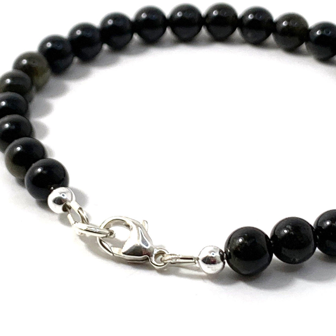 Unveiling the Mystique of Obsidian: The Timeless Gemstone of Strength and Protection